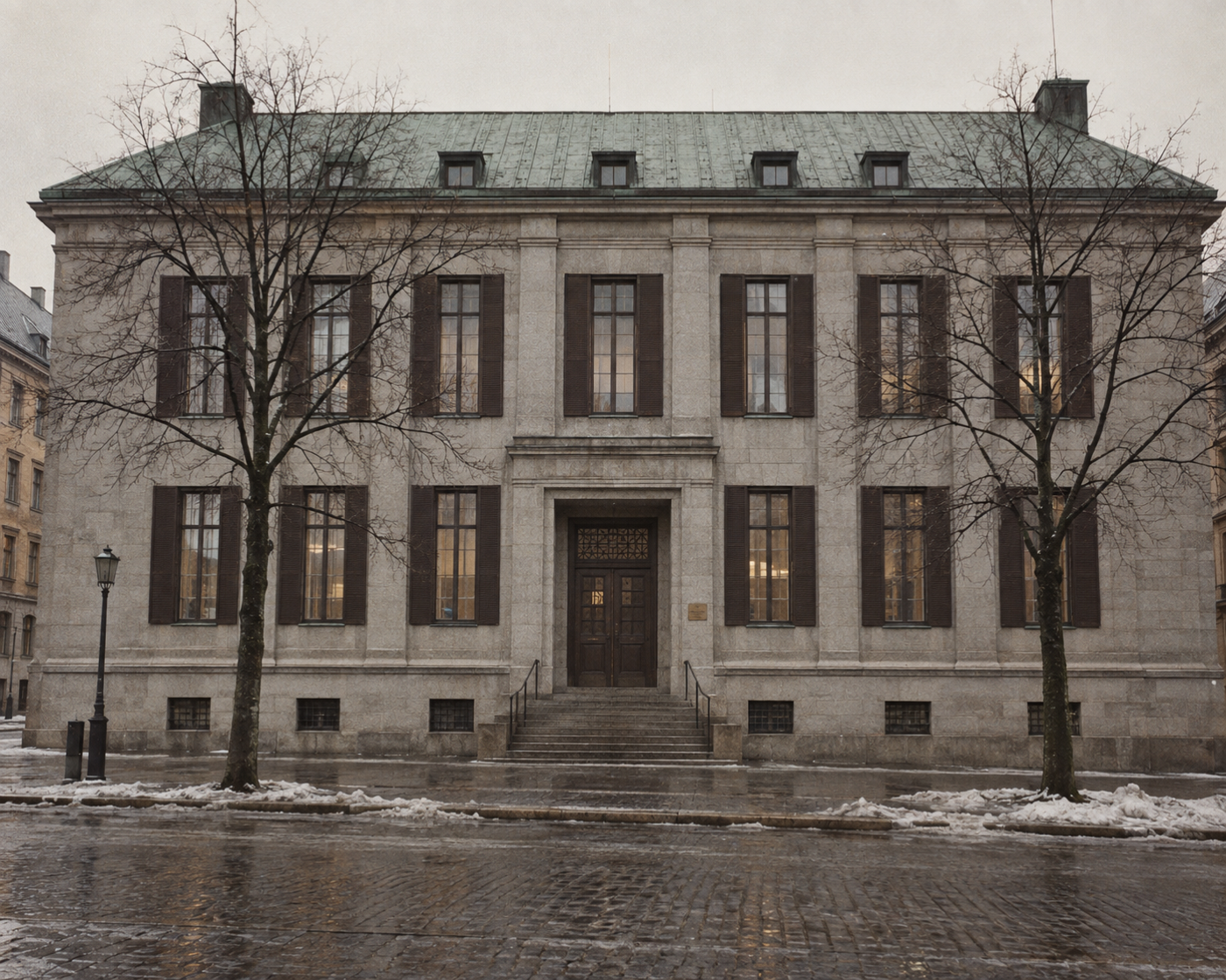 The archive from the street: a grey stone civic building on a winter afternoon, tall shuttered windows in a flat facade, a plain door at the top of a short flight of steps, and no sign saying what is kept inside.